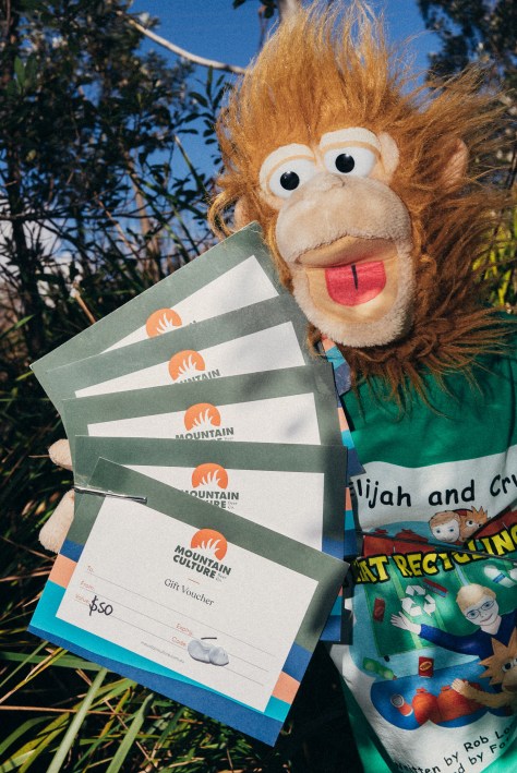 Crumpet holding 5 Mountain Culture $50 gift vouchers